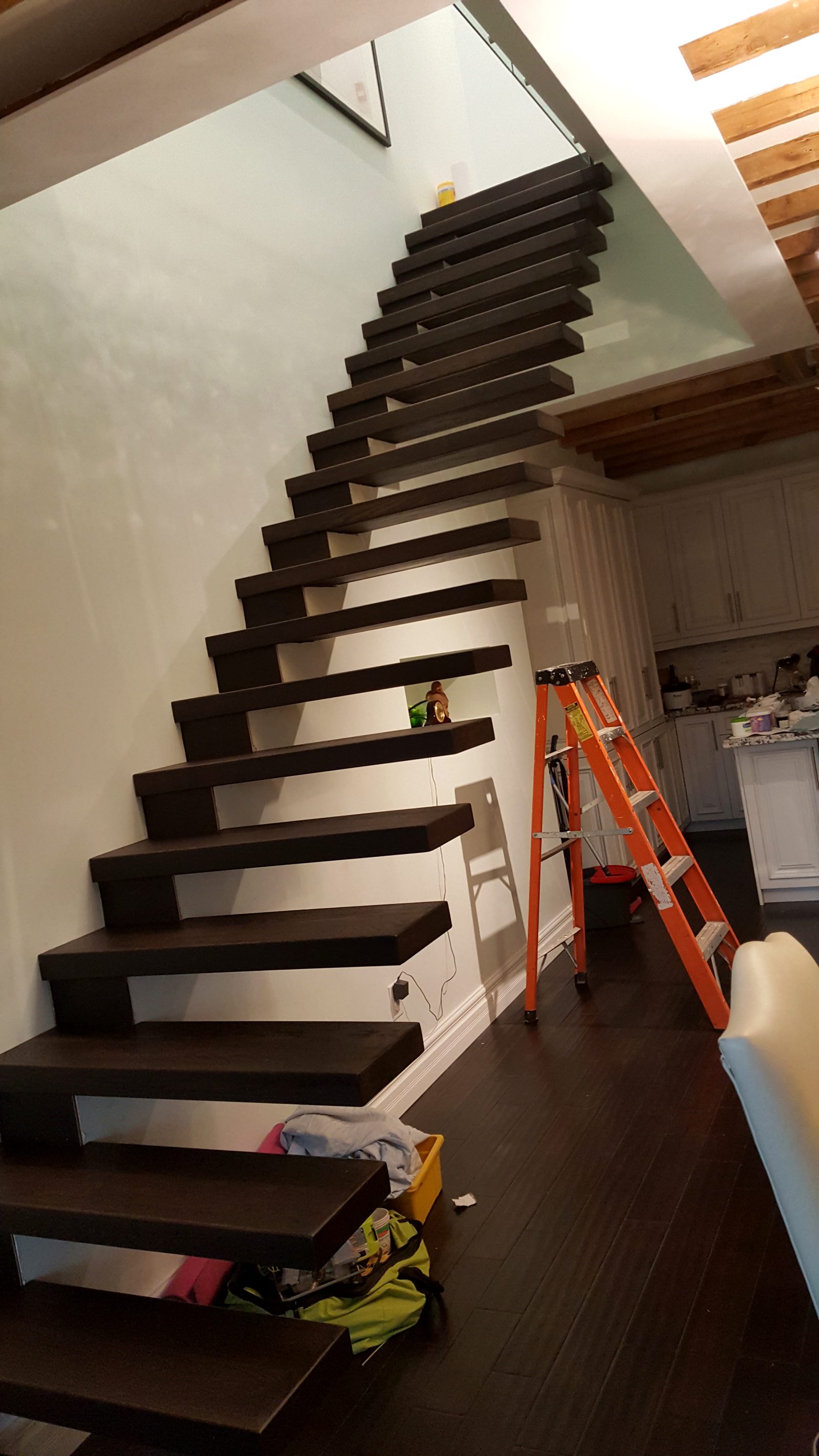 Cantilevered floating stair treads installed in a private home